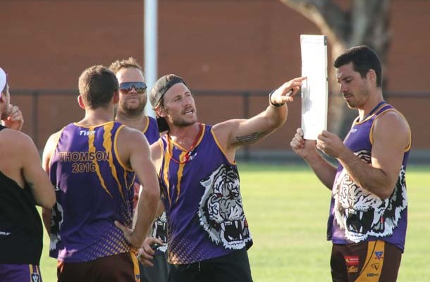 Thomson co-coach Reece Holwell addresses his players at training. Picture: AL PACKER